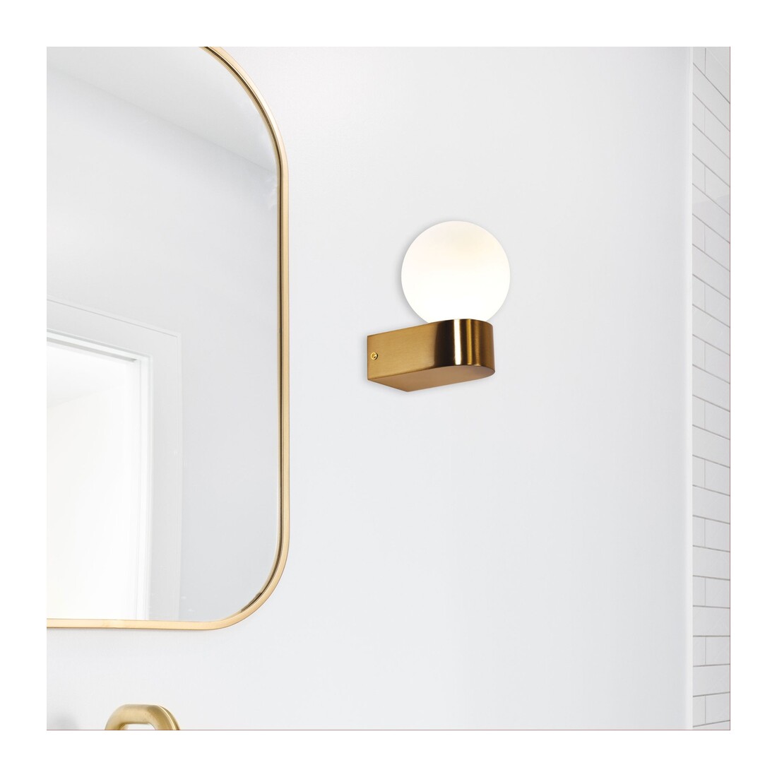 Satin brass globe beside an arched mirror — Minne Wall Light IP44 Satin Brass